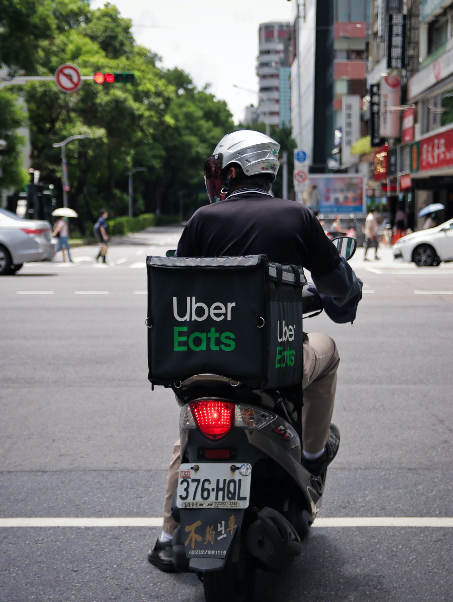 back of moped with Uber Eats carrier box